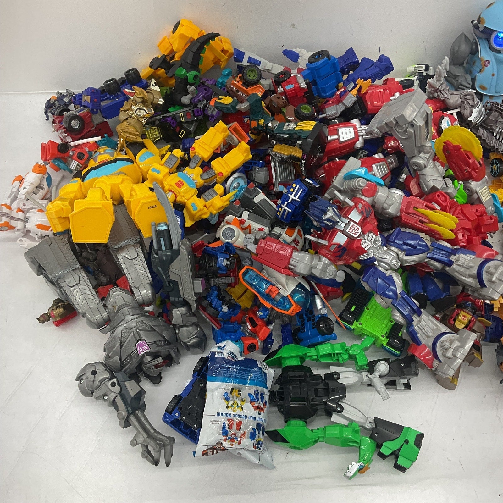 HUGE LOT 25 lbs Modern Transformers Optimus Prime Robots Preowned Action Figures - Warehouse Toys