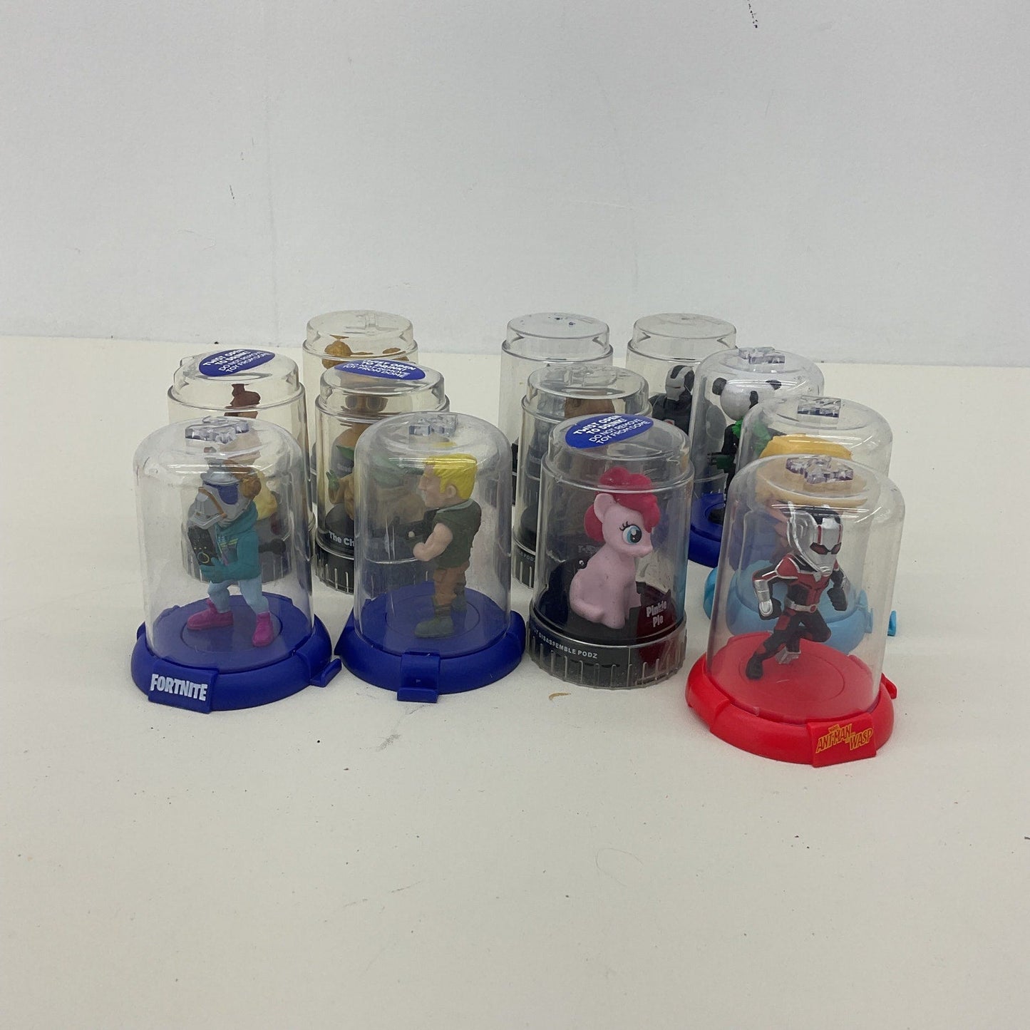 Preowned Disney Podz Assorted Toy Figures in Capsules LOT - Warehouse Toys