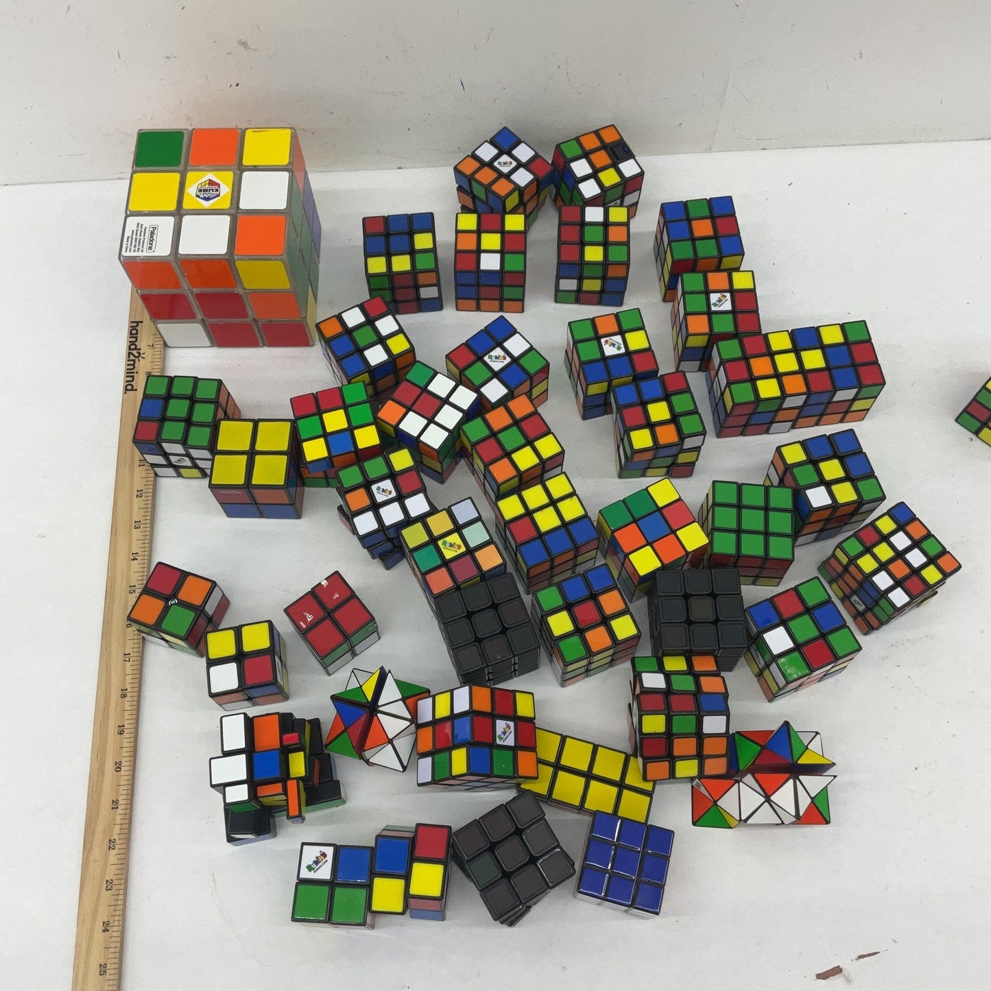 Preowned Mixed LOT 10 lbs Rubik's Cube & Other Brain Teaser Puzzle Square Toys - Warehouse Toys