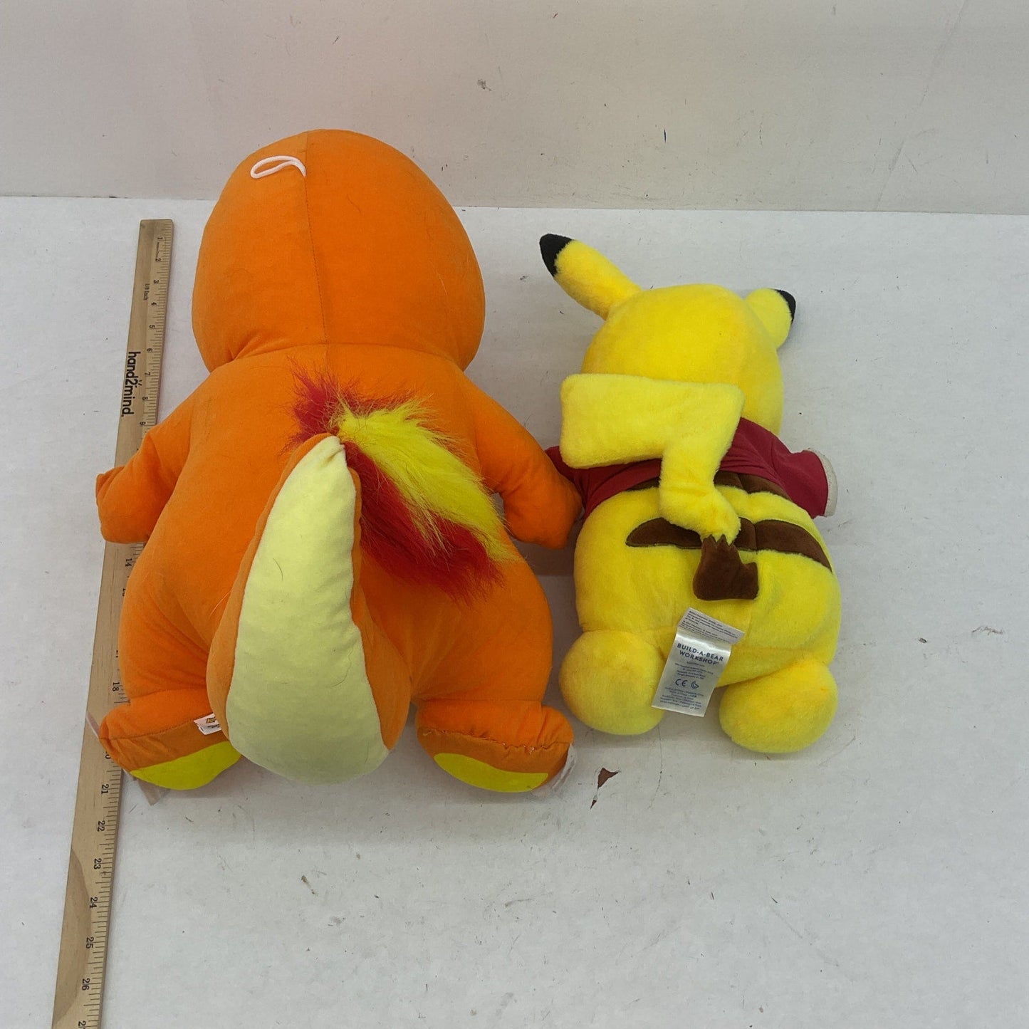 Preowned Orange Charmander & Yellow Pikachu Pokemon Stuffed Animals LOT of 2 - Warehouse Toys