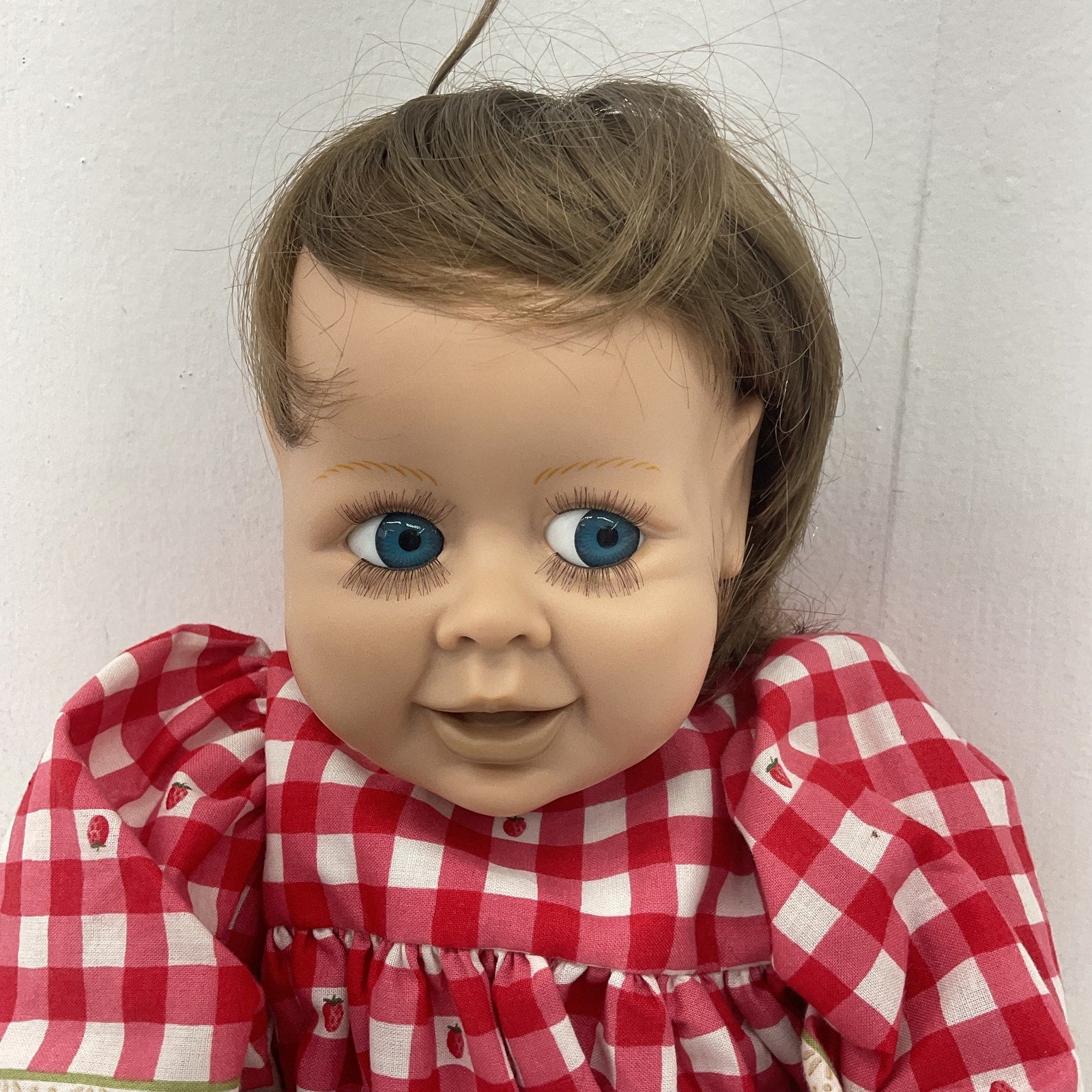 Preowned Syndee Brunette Baby Doll in Red Gingham Dress Blue Eyes Caucasian Girl - Warehouse Toys