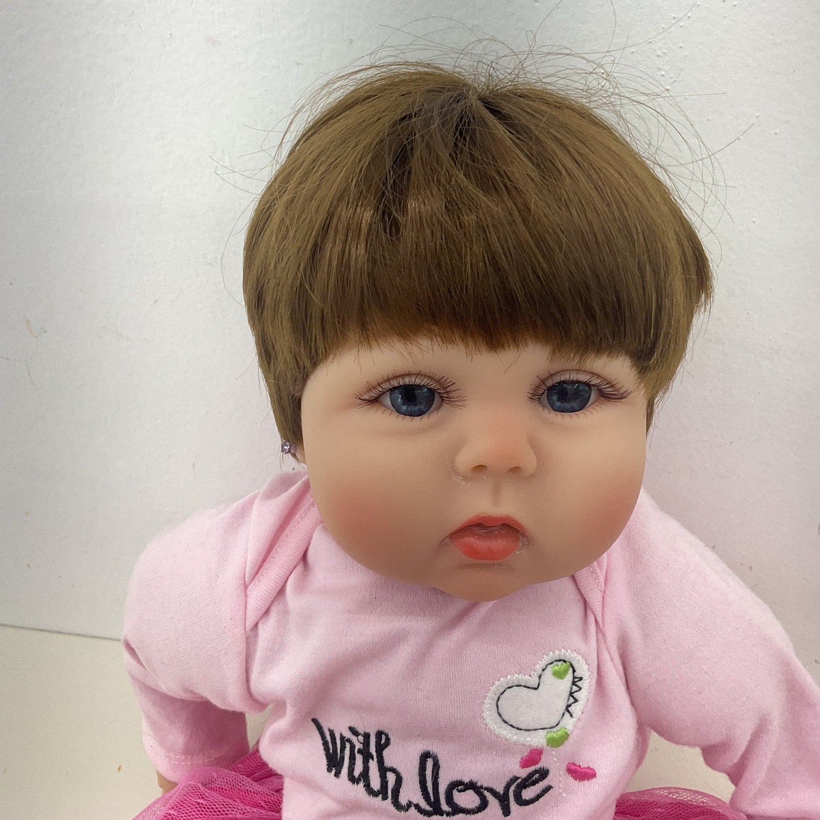 Preowned Unbranded Realistic Brunette Little Caucasian Girl Baby Doll Pink Dress - Warehouse Toys