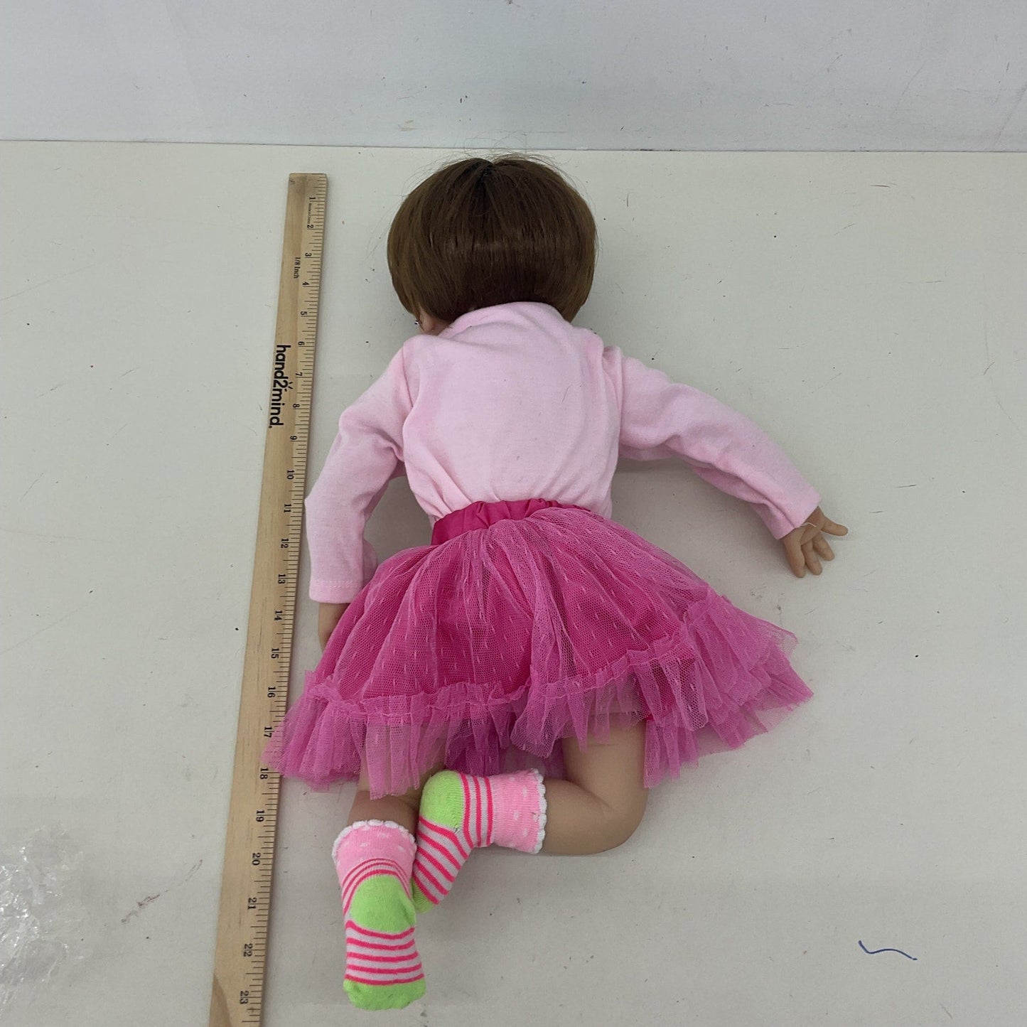 Preowned Unbranded Realistic Brunette Little Caucasian Girl Baby Doll Pink Dress - Warehouse Toys