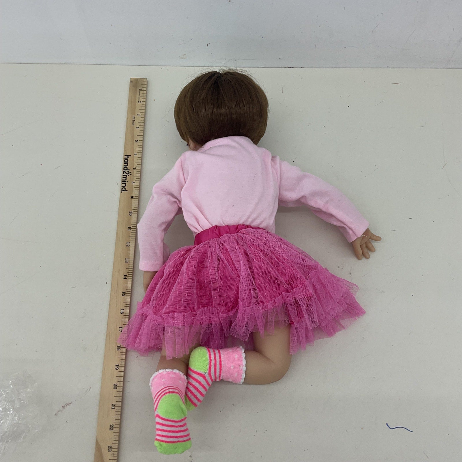 Preowned Unbranded Realistic Brunette Little Caucasian Girl Baby Doll Pink Dress - Warehouse Toys