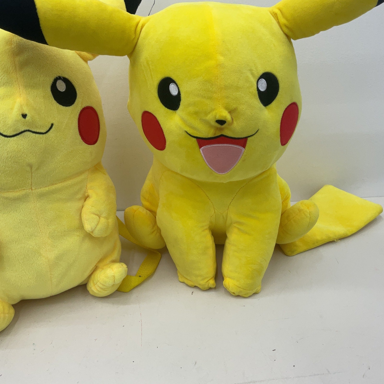 Preowned Yellow Pokemon Pikachu Plush LOT of 2 Sitting Position Designs - Warehouse Toys