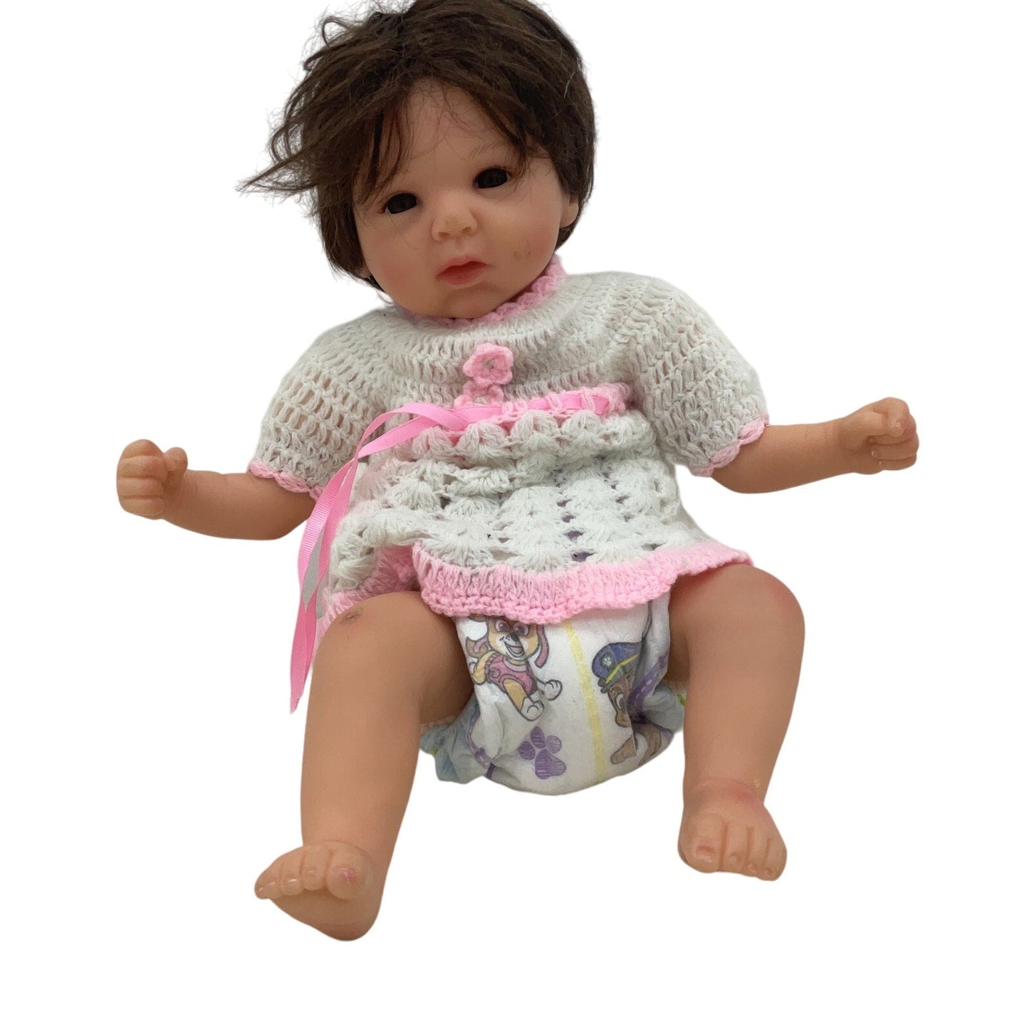 Unbranded Numbered Realistic Brunette Baby Doll in White Dress - Warehouse Toys