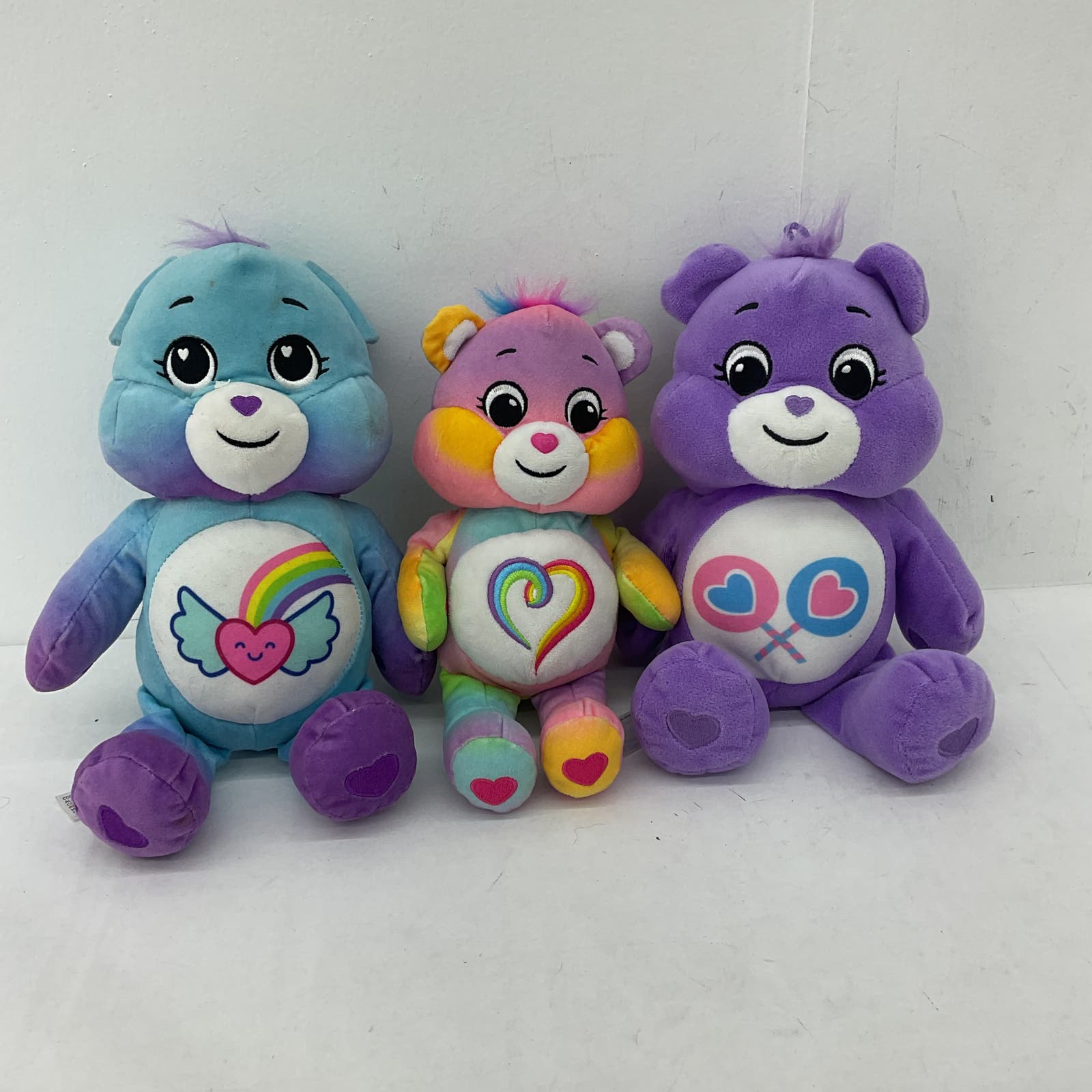 Purple care bear with 2024 rainbow